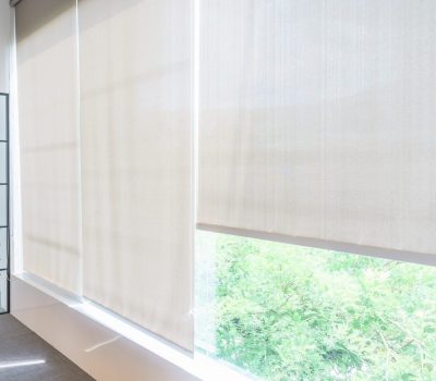 Roll Blinds on the windows, the sun does not penetrate the house. Window in the Interior Roller Blinds. Beautiful Blinds on the Window